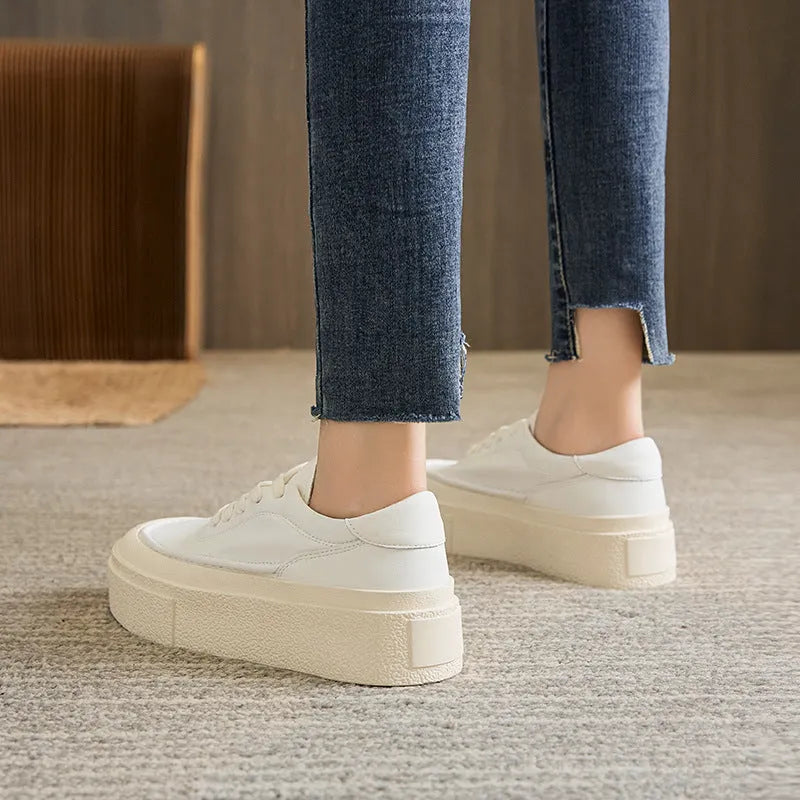 Women's black platform casual board shoes with embossed cowhide leather and round toe