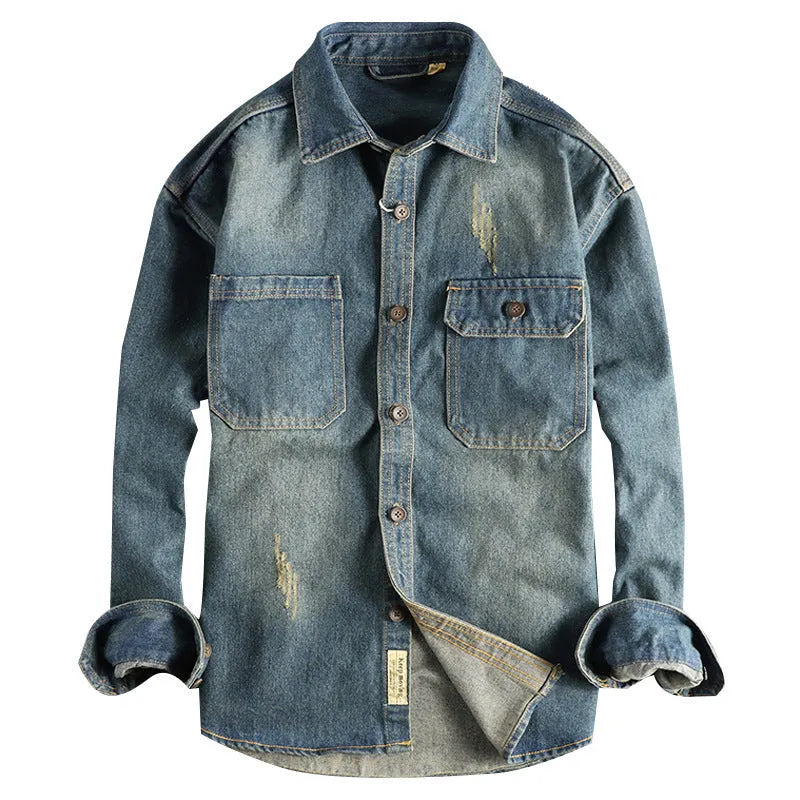 Men's light blue vintage wash denim shirt with loose fit and long sleeves on hanger