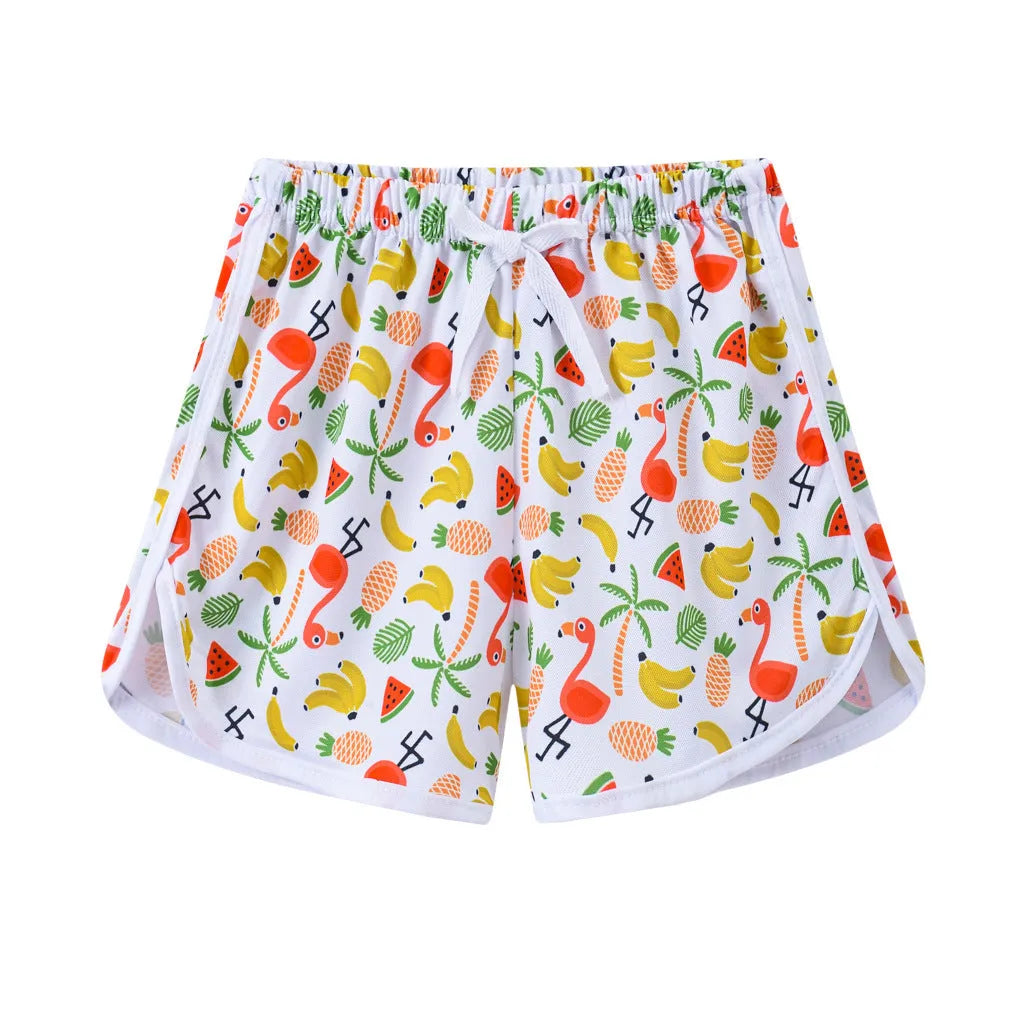 Children's polyester shorts in various colours and prints for beach holidays.