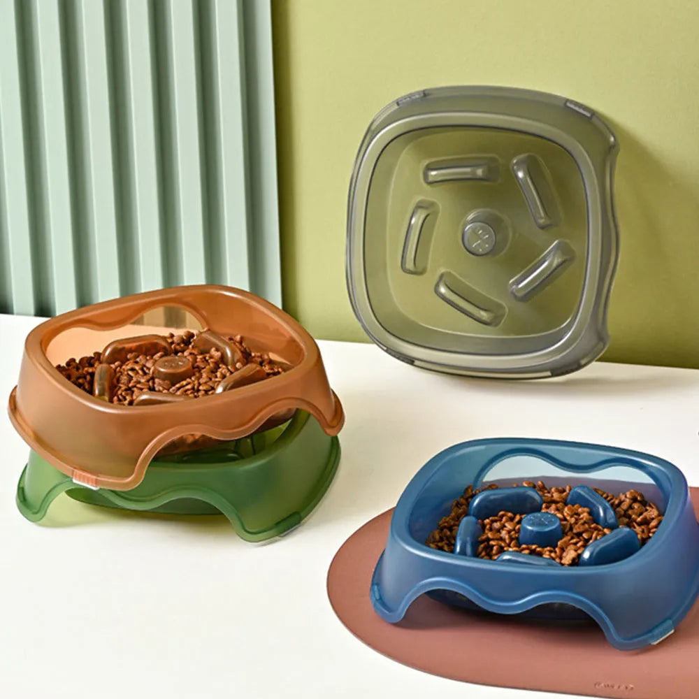 Blue slow feed anti-choke dog bowl with raised centre pattern on a non-slip base.