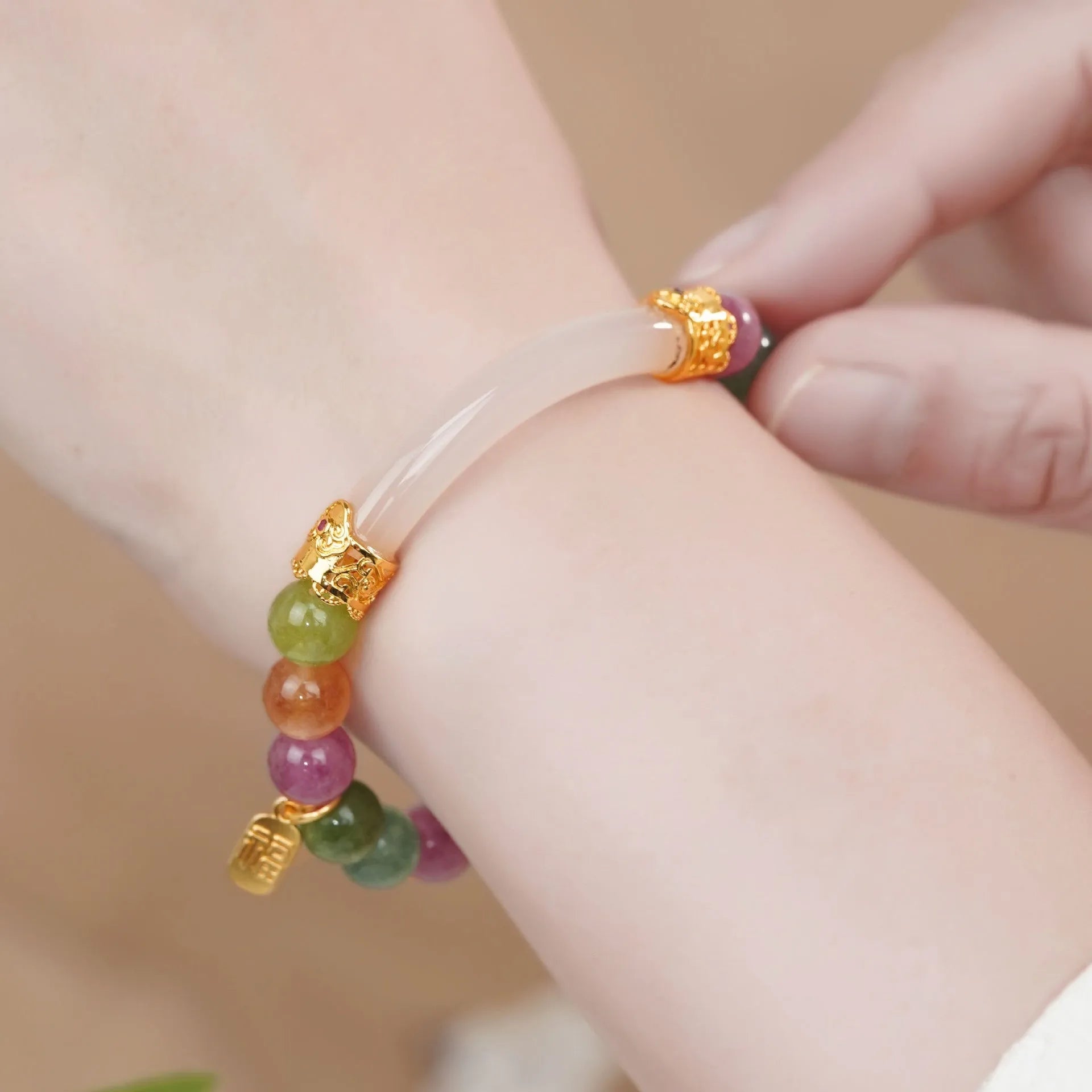 Natural rainbow tourmaline jade half-bracelet for women showing colourful stone construction