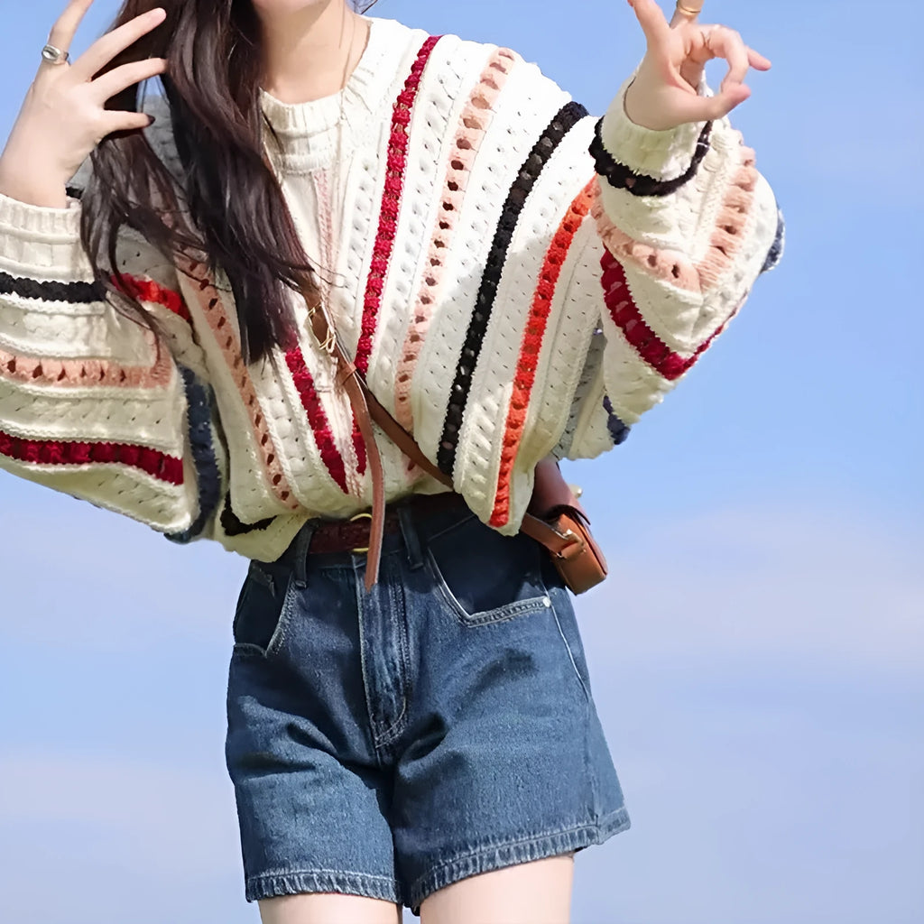 Rainbow striped sweater with batwing sleeves in loose fitting retro casual style