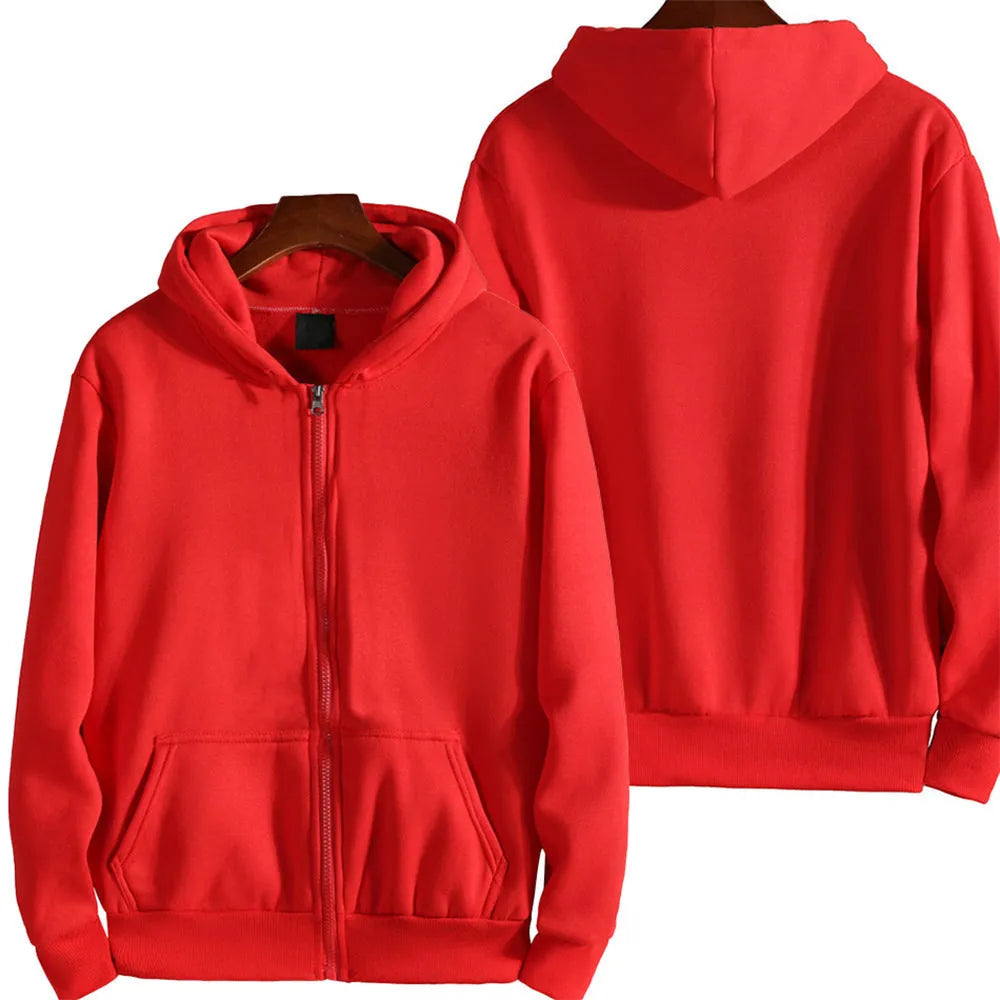 Man wearing a loose-fit solid colour zip-up sports jacket in a casual setting.