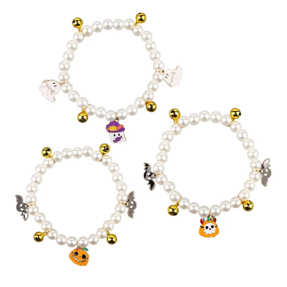 Halloween pet collar charm with simulated pearls and a choice of pumpkin or ghost decoration.