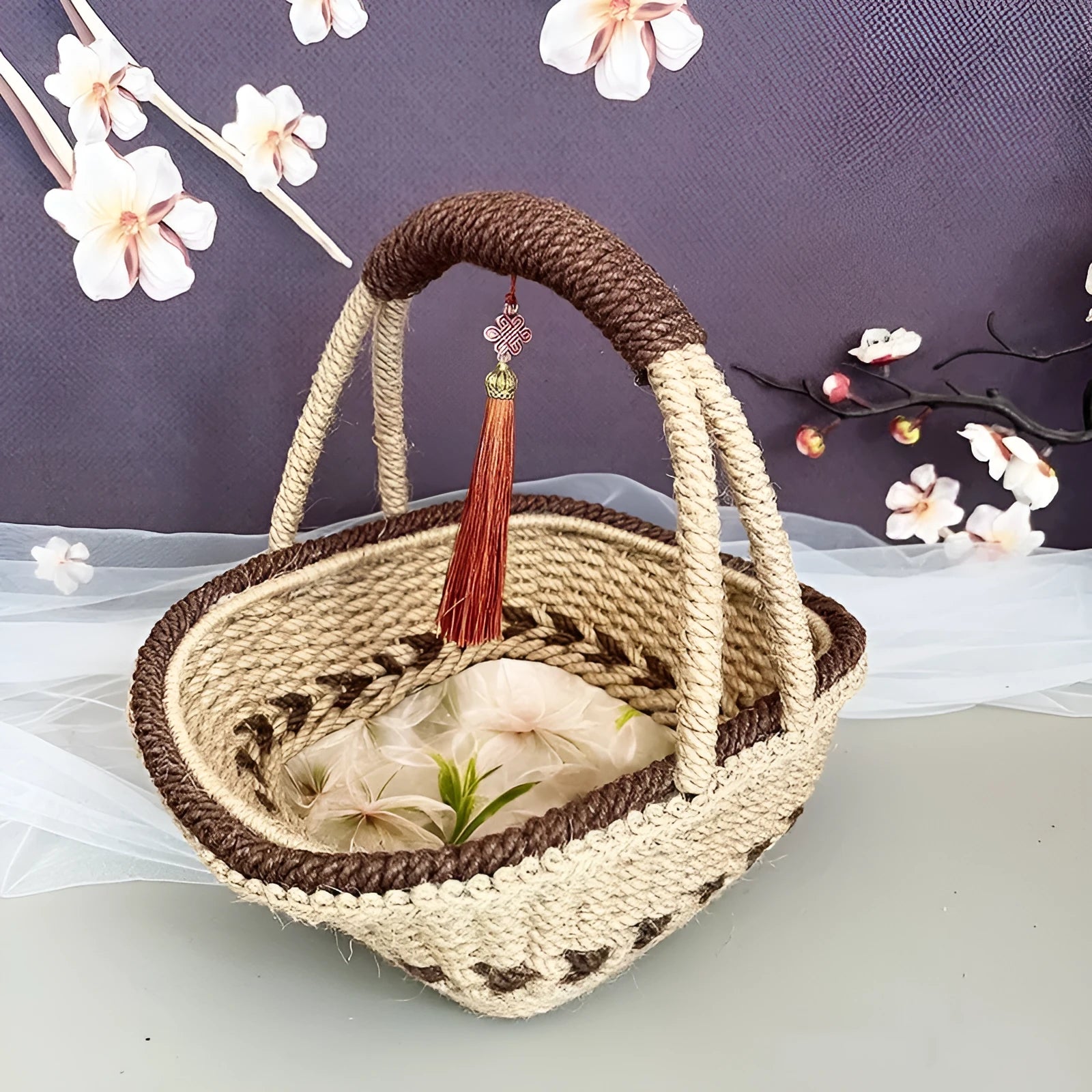 A hand-woven straw basket in a coffee brown colour, measuring 19cm by 12cm.