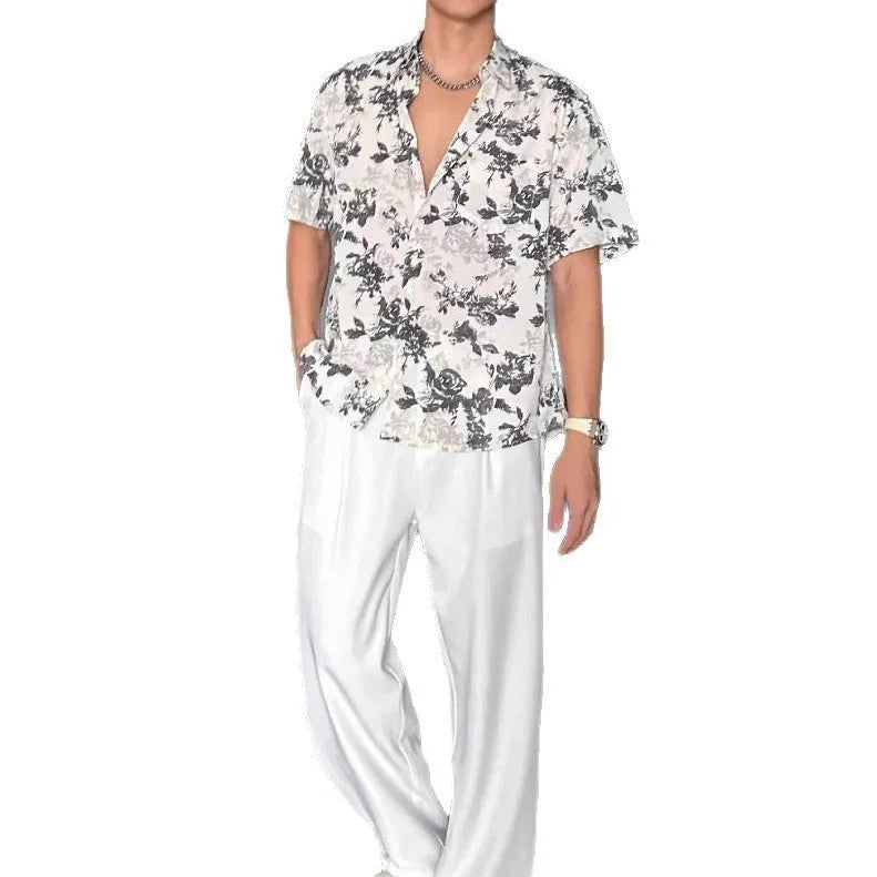 Men's loose-fit printed short sleeve shirt with pendant detail and floral pattern in white or black colours
