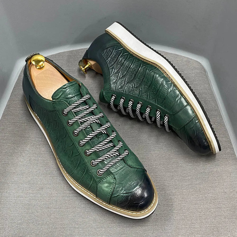 Men's handmade low-top shoes with embossed pattern detail and front laces.