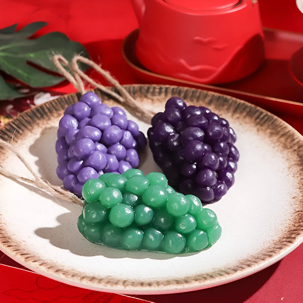 Purple and green grape cluster handmade soap bars showing grape design moulded into surface