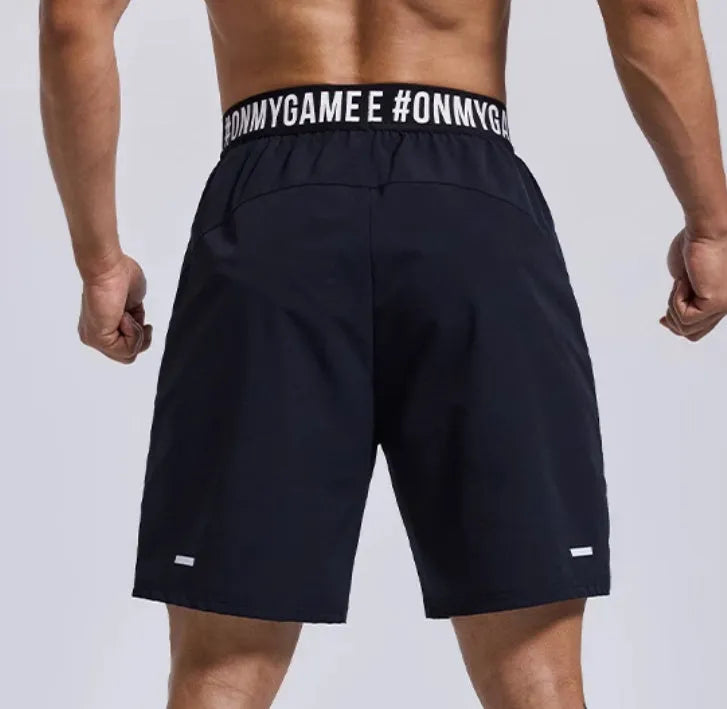 Men's loose black athletic shorts with elastic waist for sports and workouts