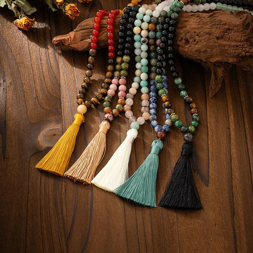 Long Bohemian necklace with geometric stone beads and tassel, plus matching bracelet, shown in an electroplated colour.