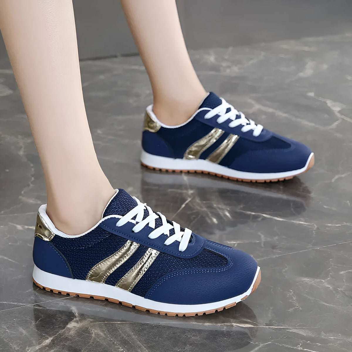 Blue women's casual tennis shoes with cross straps and a white rubber sole.