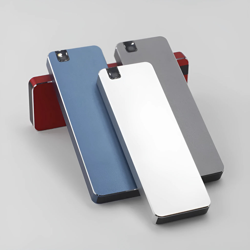 White metal-shell mobile solid state drive with USB 3.1 cable on packaging