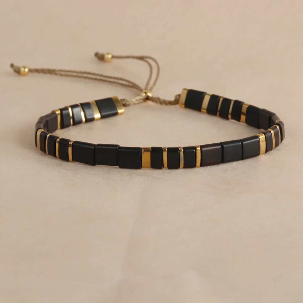 Geometric glass pull bead bracelet in milky white, black, green, blue or red with round decorative elements