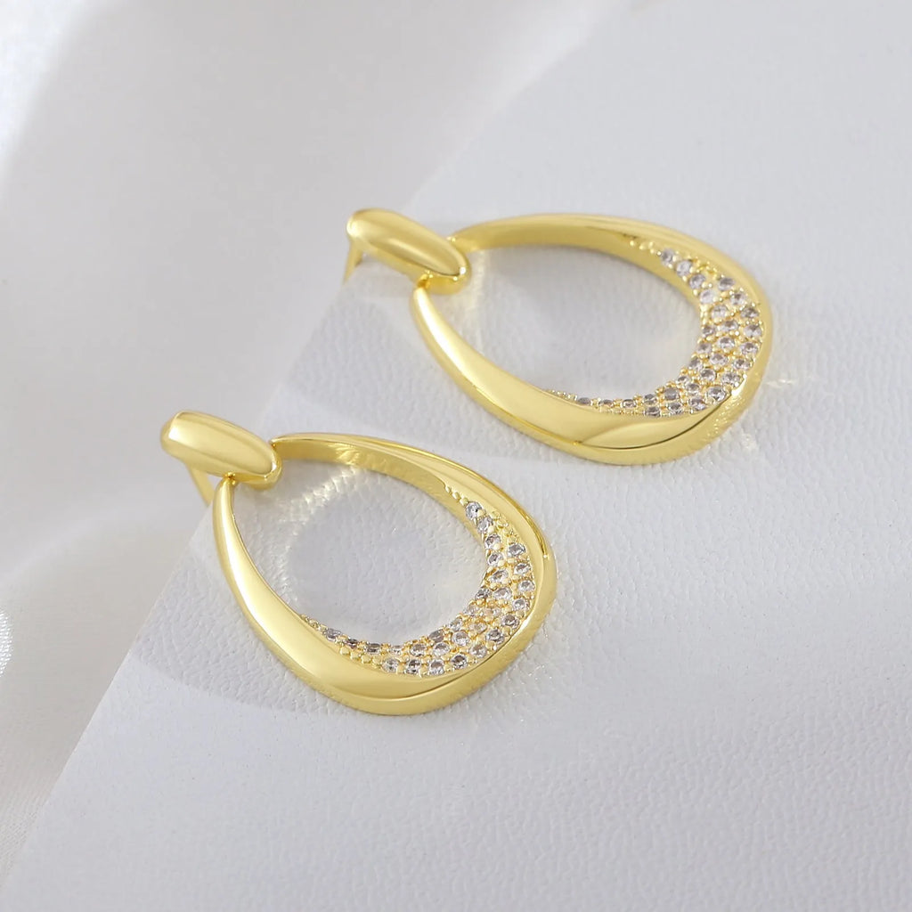 Yellow gold geometric drop earrings with ring design elements measuring 2.6cm