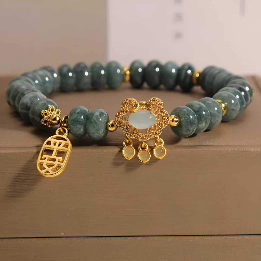 Natural emerald green jade abacus beads bracelet with a metallic alloy safety lock clasp.