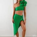 Women's black two-piece swimsuit with a raised three-dimensional floral pattern, showing bikini top and bottom.