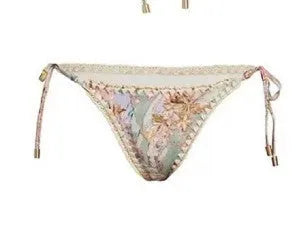Women's creamy-white floral print bikini set with matching skirt for beach use