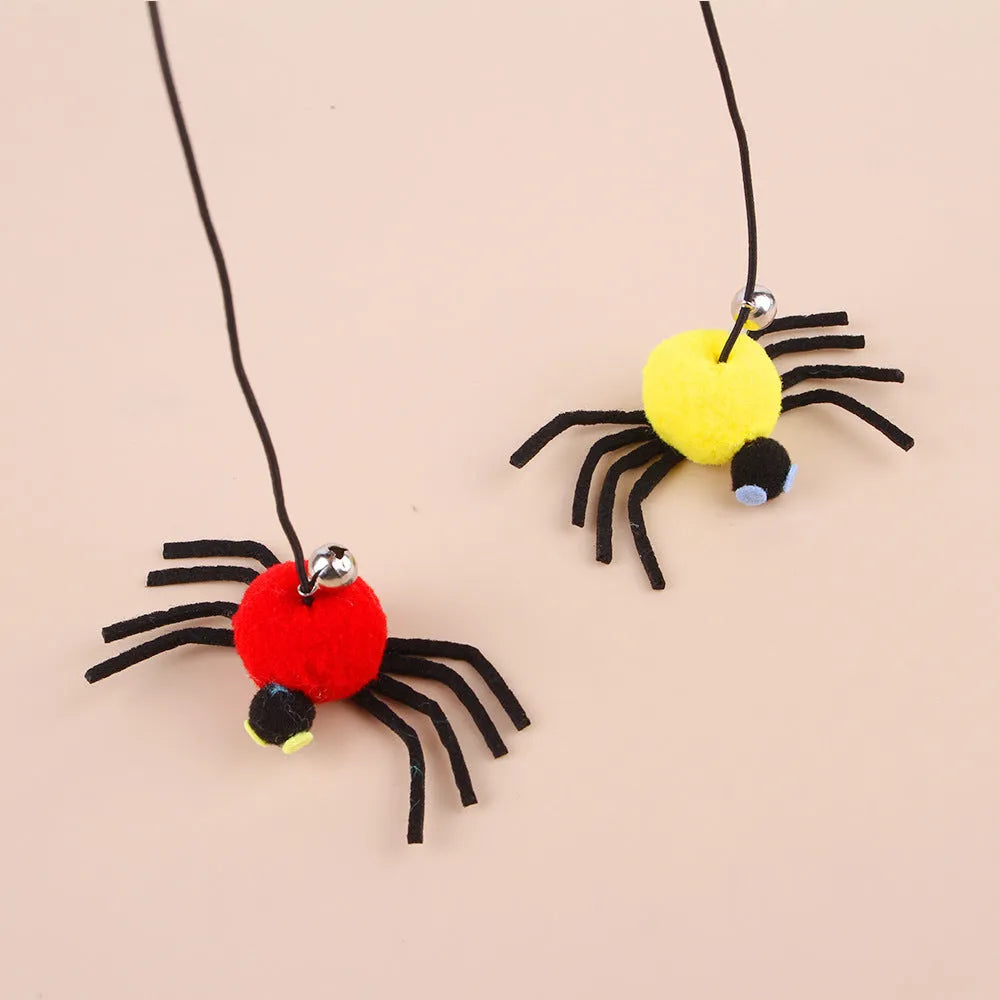 Red cat door hanging toy with swinging elastic rope, feather attachment, and bell spider