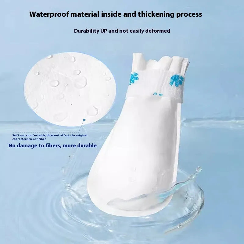 White disposable waterproof shoe covers for dogs with non-slip soles in S and M sizes