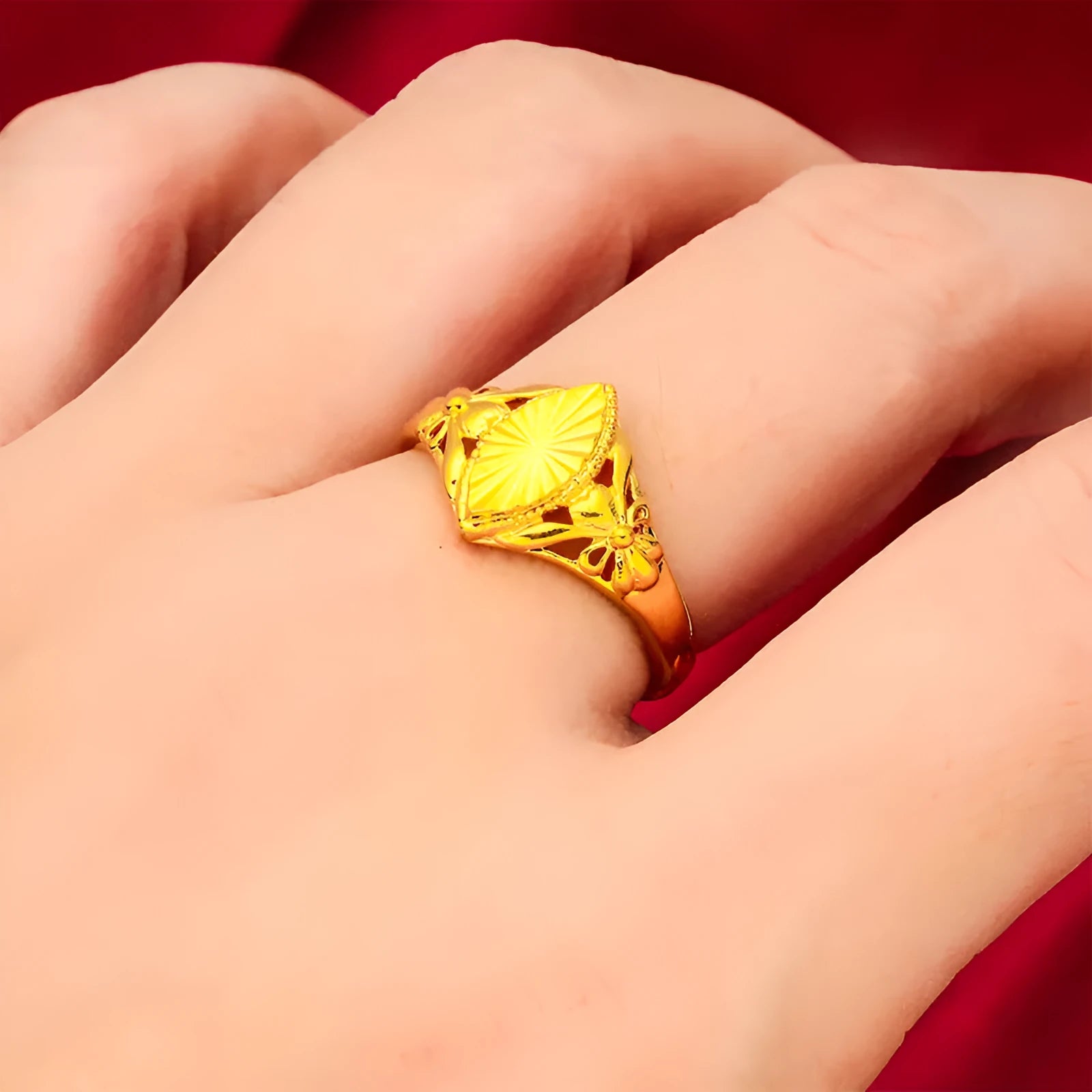 Geometric brass flower ring with gold electroplated finish showing textured diamond design