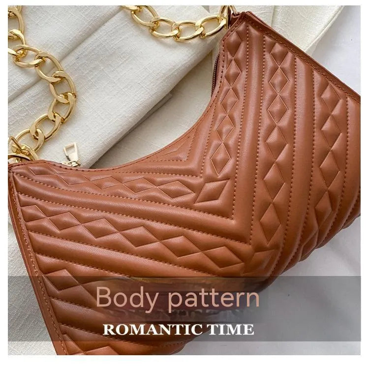 Brown pleated chain baguette shoulder bag with adjustable strap and soft carry handle