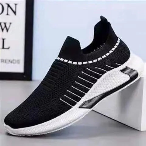 Men's black and white striped mesh slip-on sneakers with lace-up front on a white background