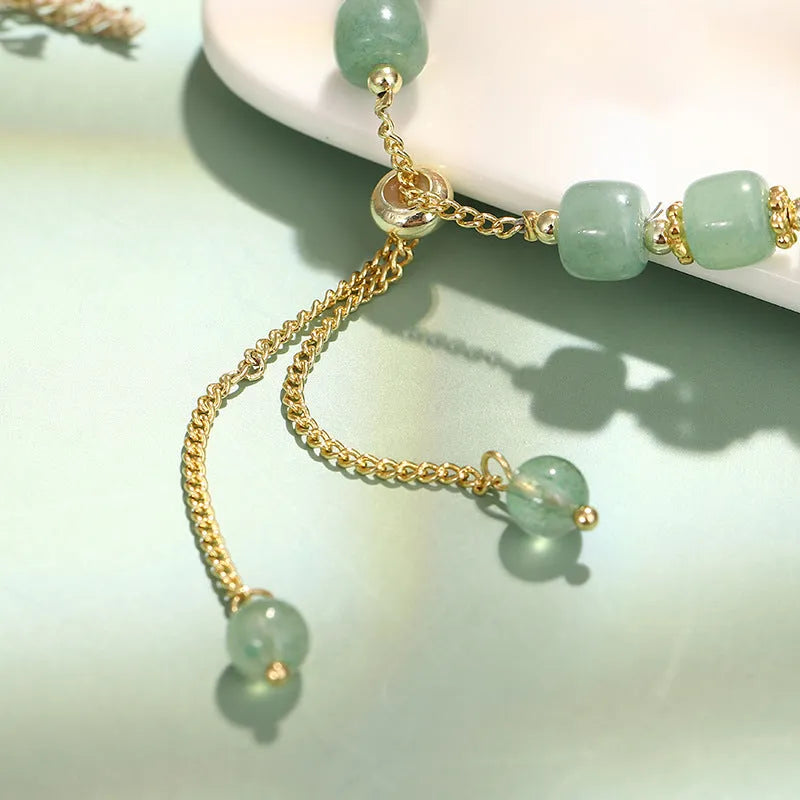 Rabbit charm bracelet with green aventurine or strawberry quartz stones on gold-plated chain