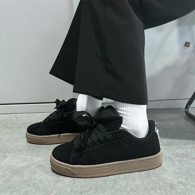 Black retro low-top sneakers with waterproof platform soles and round toe design