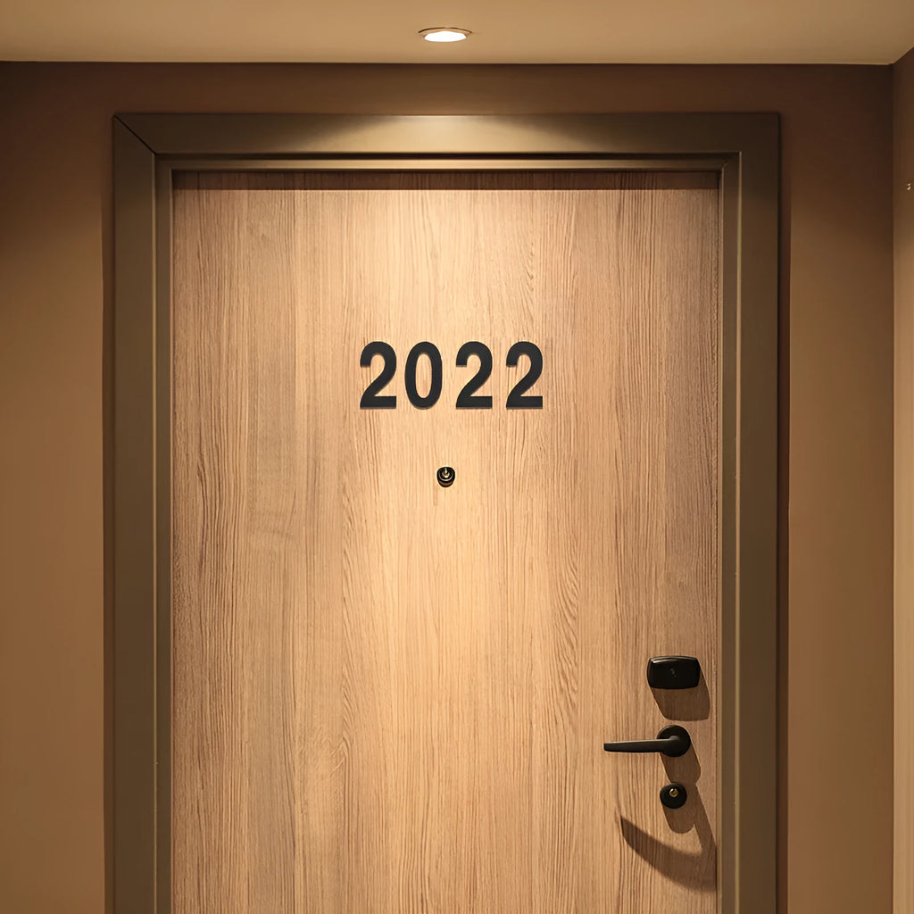 Black stainless steel adhesive house numbers and letters, each 7.5cm tall, for property identification.