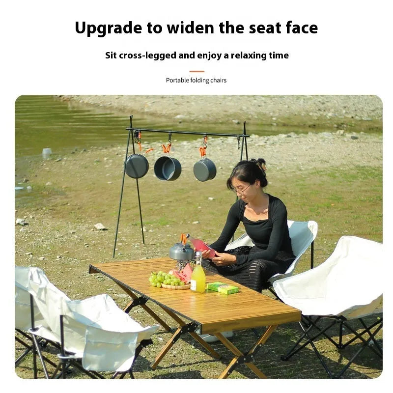Beige folding outdoor camp chair with steel frame and Oxford cloth seat in the open position