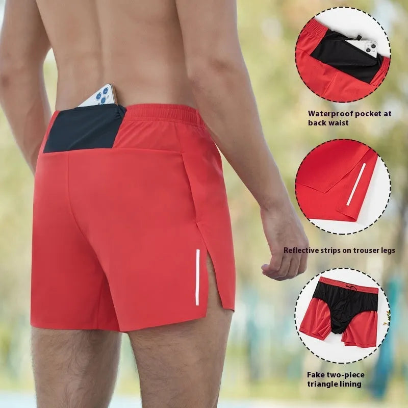Men's red off-road running shorts with high waist and loose fit on a running trail.