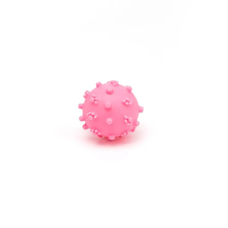 Four bright coloured spiky dog balls with paw print dimples, 2-inch diameter for small breed puppies