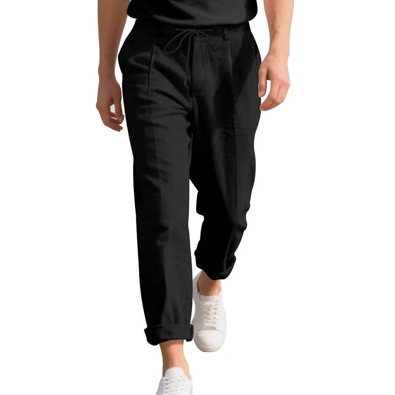 Men's casual linen trousers in a straight leg cut with a drawstring waist, shown in a light colour.