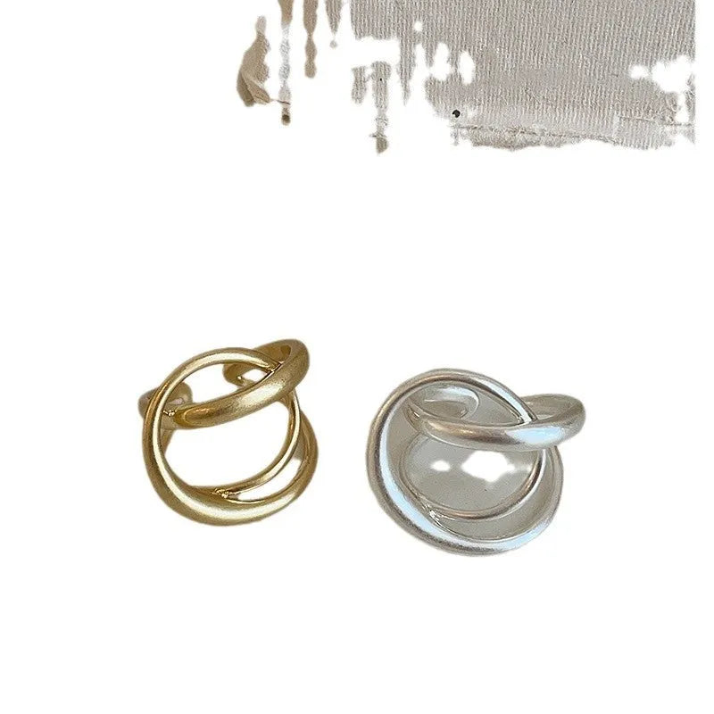 Three-dimensional interlaced geometric open ring with matte metal finish