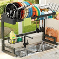 Black metal retractable sink draining rack for water pots, shown for sink or table top use