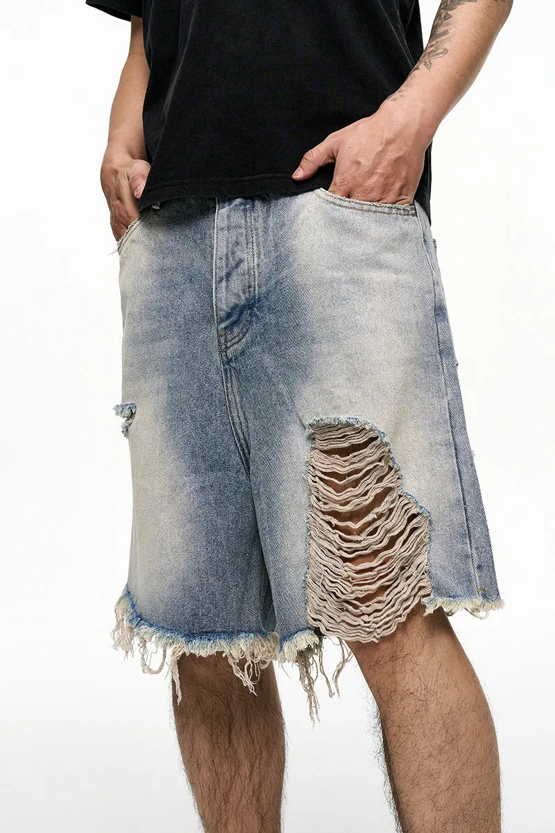 Light blue men's baggy denim shorts with wide leg and zipper fly