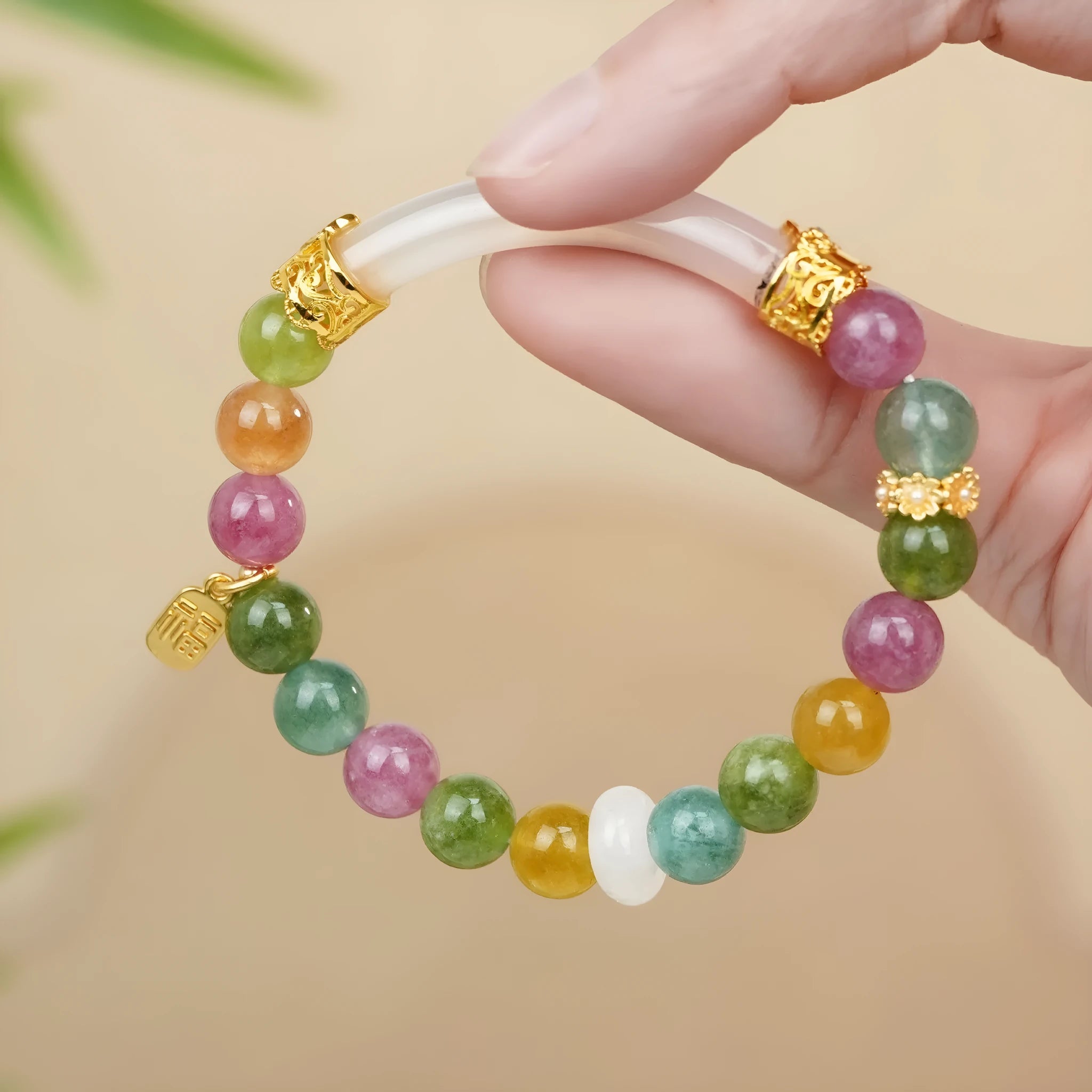 Natural rainbow tourmaline jade half-bracelet for women showing colourful stone construction