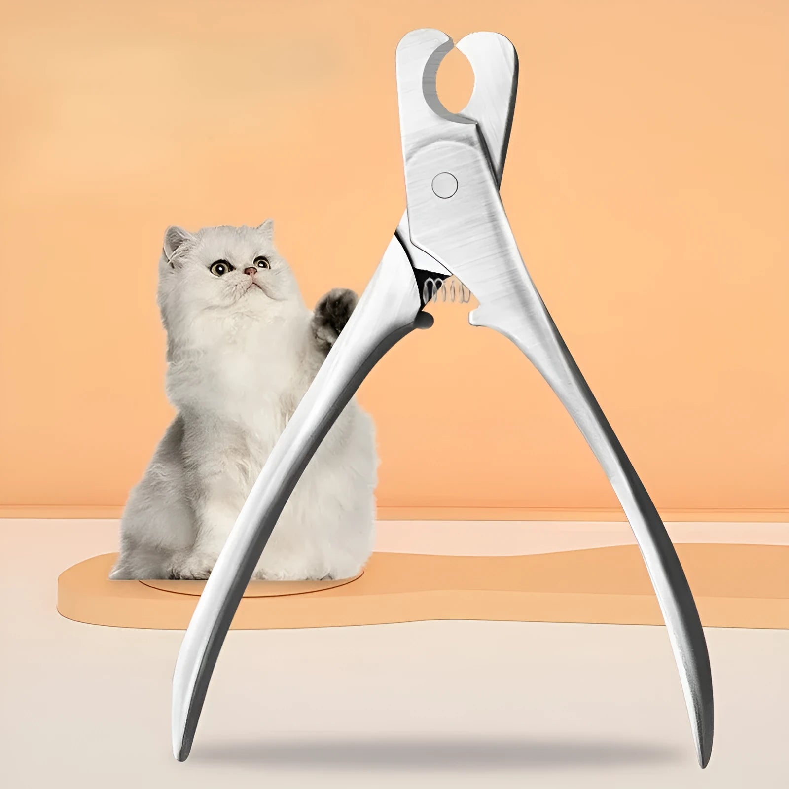 Silver professional pet nail clipper with curved stainless steel blade and finger guard for dog and cat grooming.