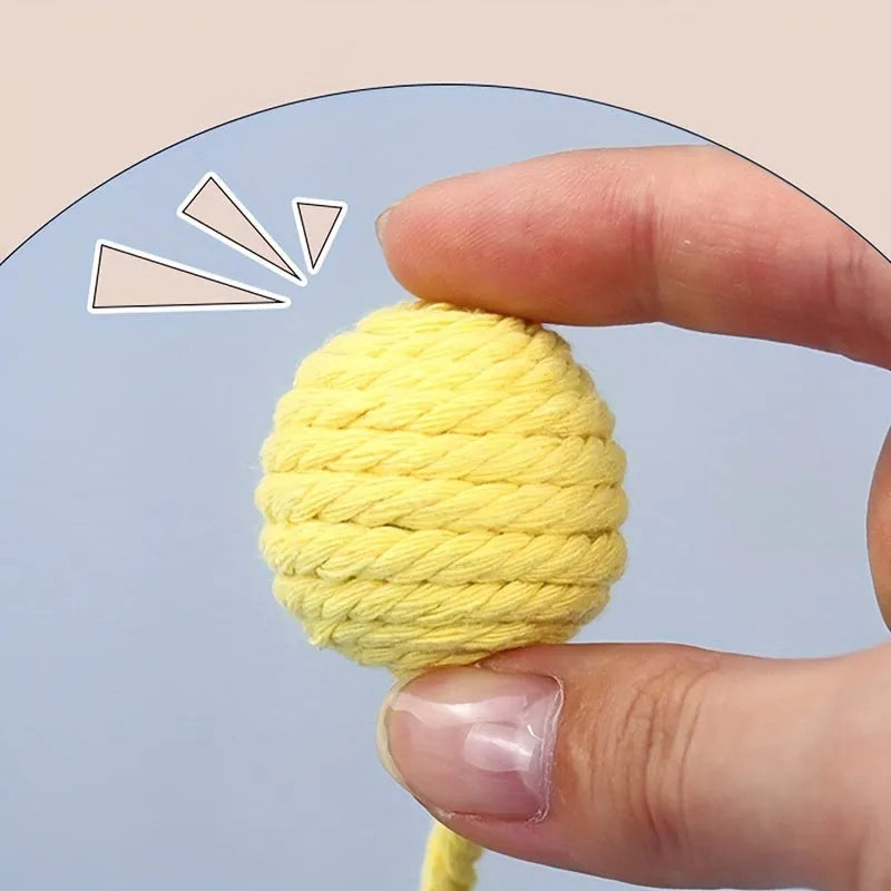 Green cat toy ball with a built-in rope and bell in a 6cm size.
