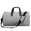 Medium oval travel bag in light grey with internal compartments for wet-dry separation.