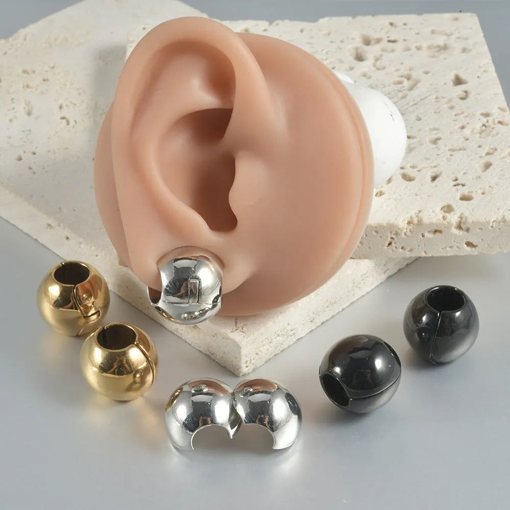 Stainless steel hollow skull Buddha earrings with geometric design in hip hop style