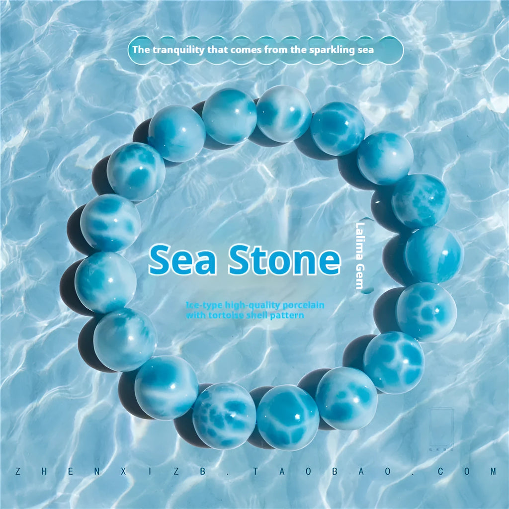 Blue Bodhi bracelet with natural sea-pattern crystal bead and pearl details in Maillard style.