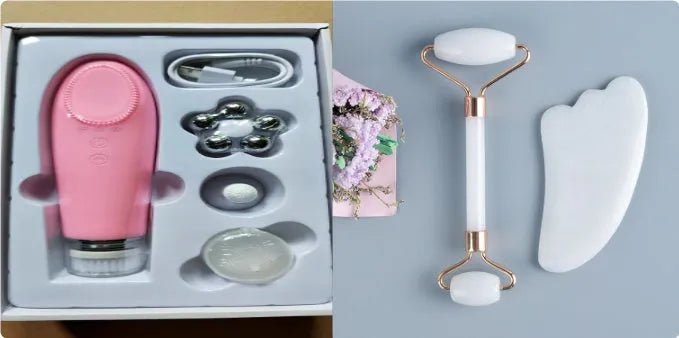White jade facial roller and gua sha board set on a plain surface.