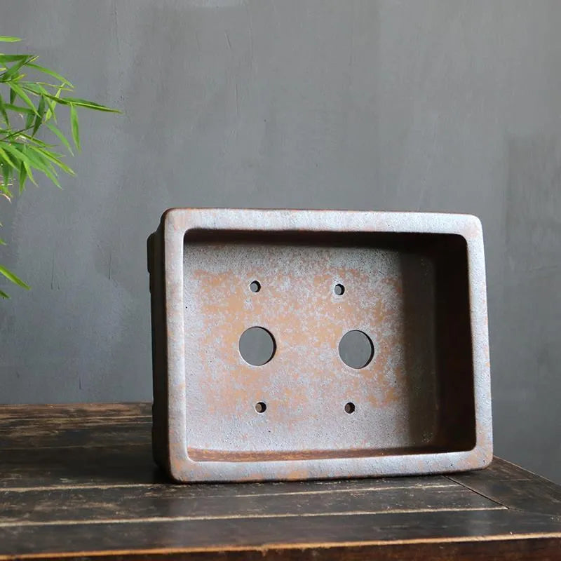 Rectangular purple sand bonsai planter with firewood burning finish and pine cypress boxwood decoration