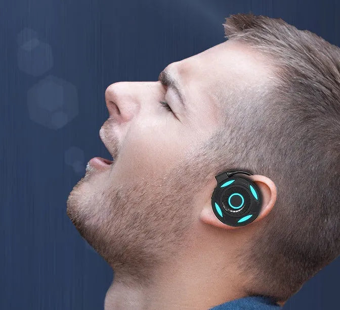 Black and white Bluetooth gaming earphones with hanging ear design and USB charging