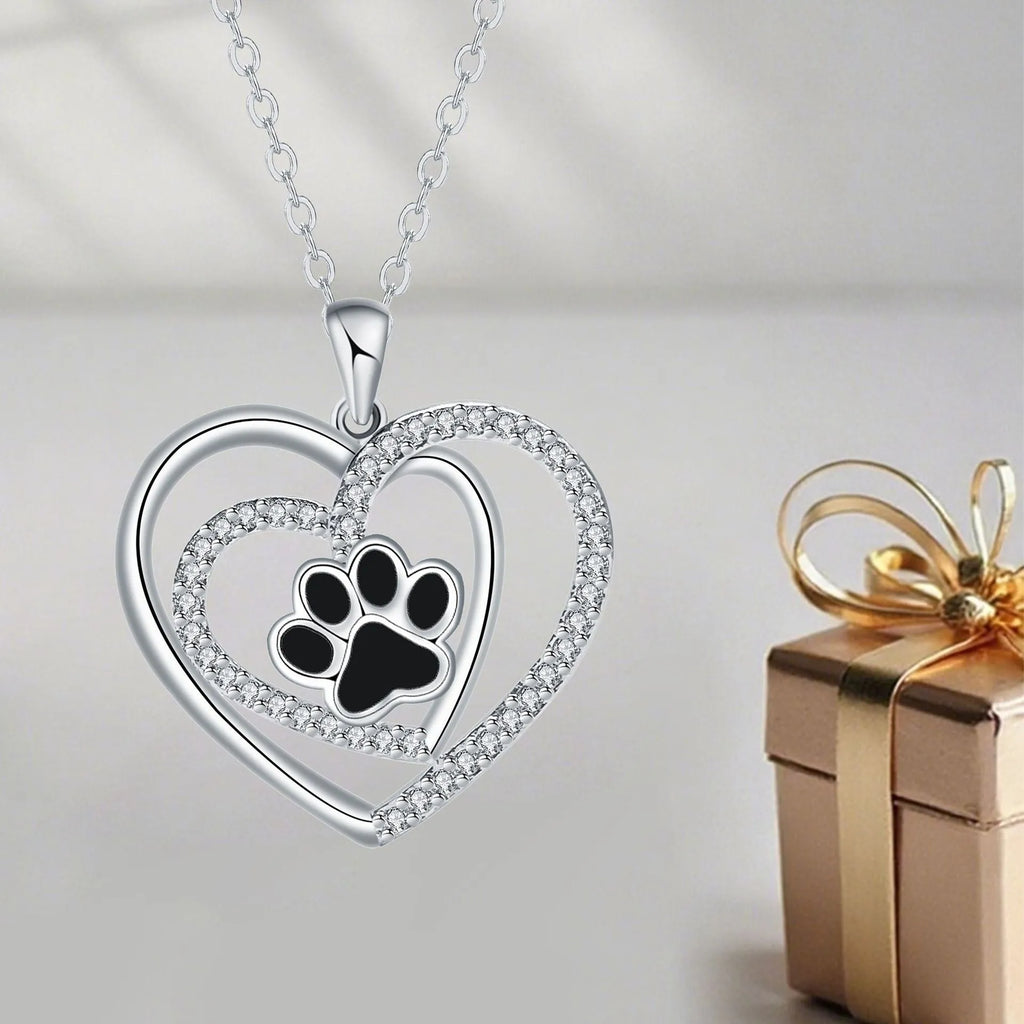 Original design heart-shaped copper necklace with a detailed dog paw print pendant on a cross chain.