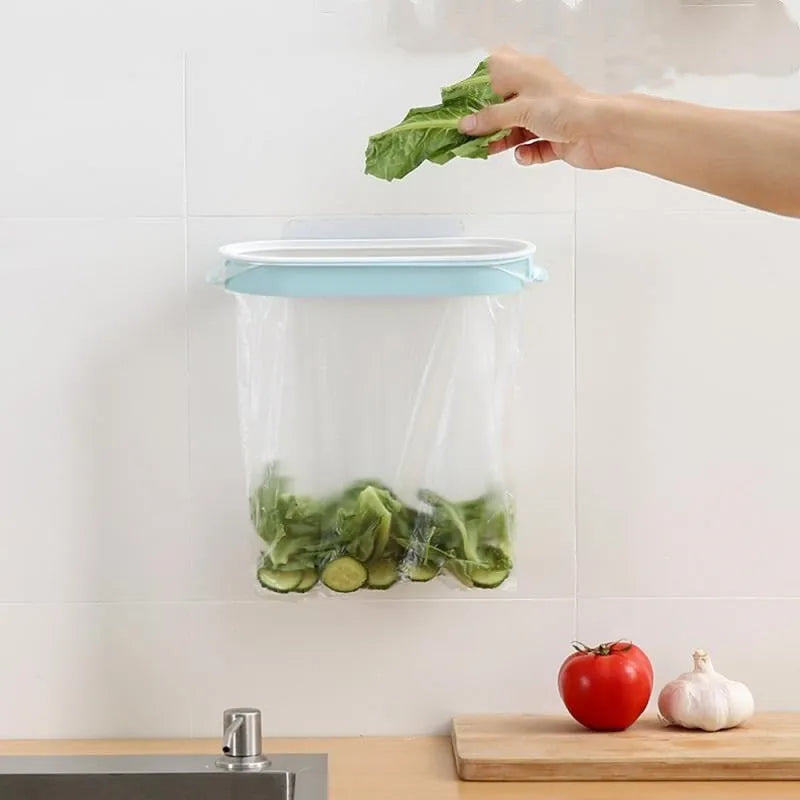 Blue plastic kitchen garbage bag storage rack mounted under cabinet holding bin liners