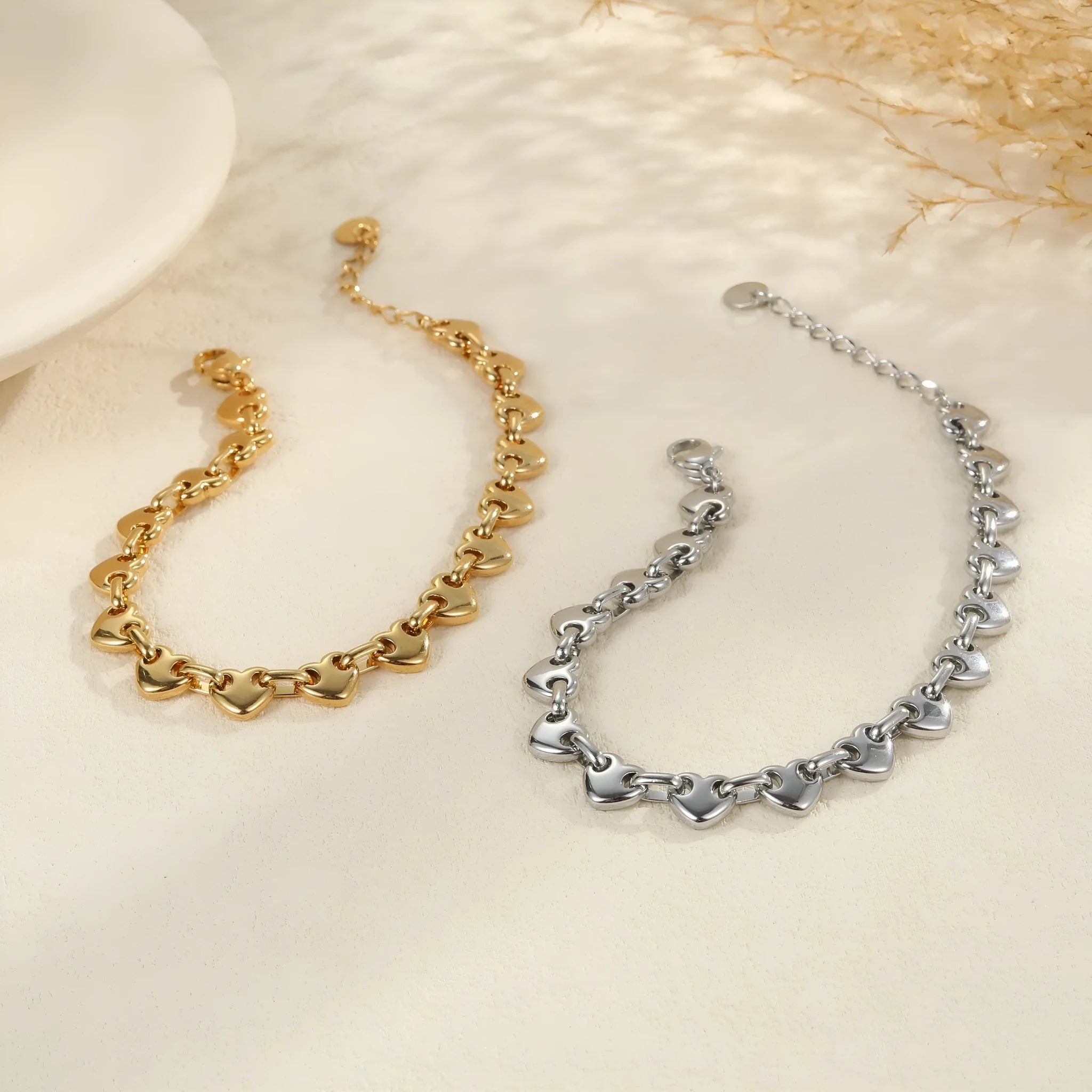 Women's hollowed-out heart bracelet in stainless steel with 18K gold plating showing geometric design