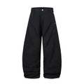 Men's black pleated casual trousers with a loose wide-leg fit and elasticated mid-waist.