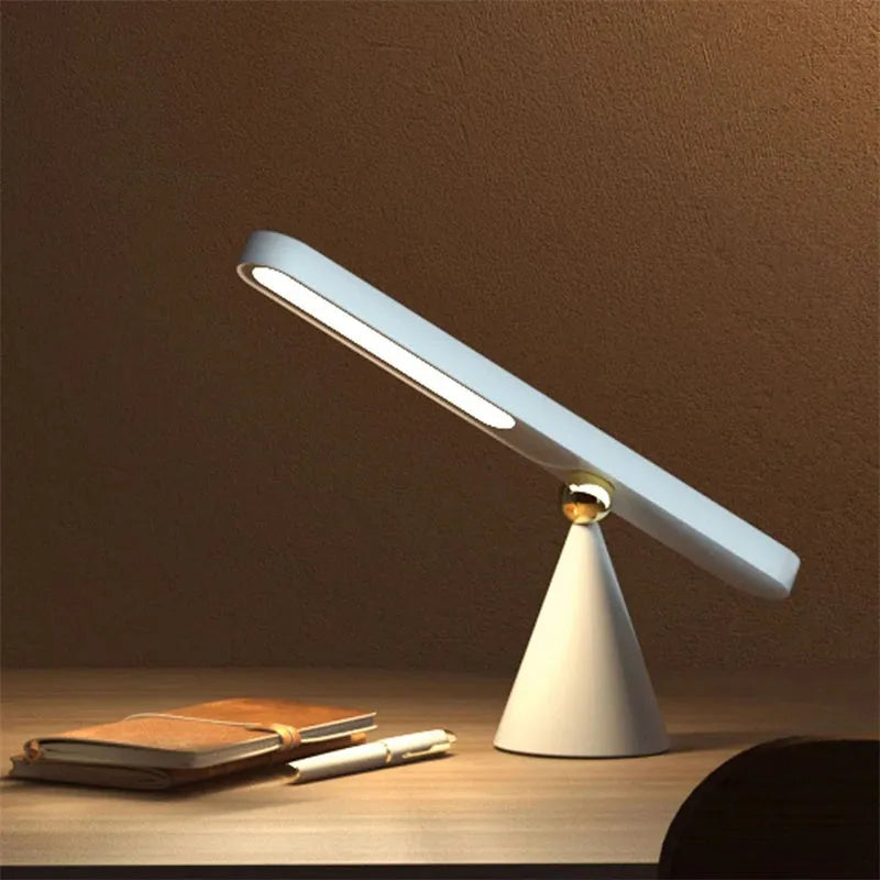 Geometric desk lamp with magnetic suction showing touch switch and USB power connection